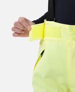 nohavice Detské lyžiarske nohavice 500 PNF s trakmi nepremokavé žlté