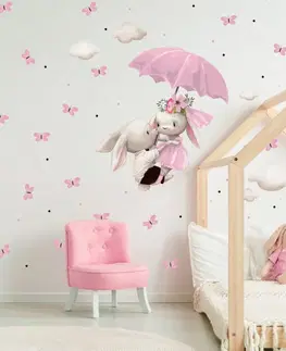 Nálepky na stenu Nálepka na stenu - Zajkovia letiaci na ružovom dáždniku