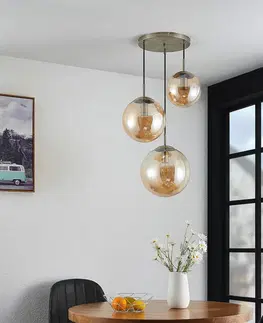 Závesné svietidlá Lindby Lindby Teeja závesná lampa, 3 sklenené gule jantár
