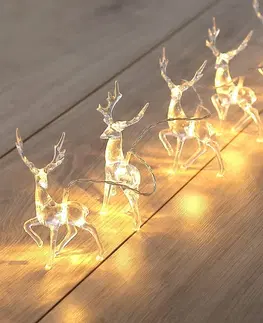 Vianočné dekorácie DecoKing Vianočná svetelná reťaz Soby teplá biela, 10 LED