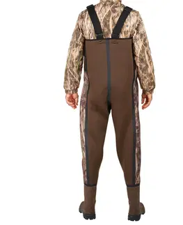 nohavice Poľovnícke brodiace neoprénové nohavice 500 hrejivé maskovanie s motívom močiara