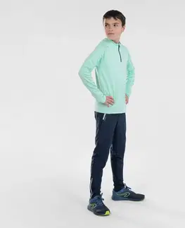 nohavice Detské hrejivé bežecké nohavice so zipsom Kiprun Warm tmavomodro-sivé