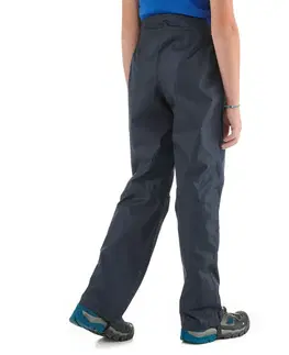 nohavice Detské turistické nohavice do dažďa MH500 7-15 rokov čierne