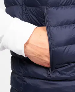 bundy a vesty Pánska prešívaná golfová vesta MW500 tmavomodrá