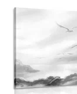 Čiernobiele obrazy Obraz prelet vtákov ponad krajinku v čiernobielom prevedení