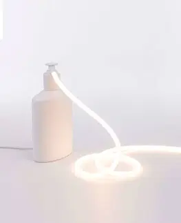 Vnútorné dekoratívne svietidlá SELETTI Stolová LED lampa Daily Glow ako dávkovač mydla